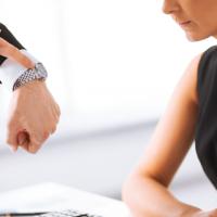 Businessman pointing at his watch