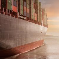 A ship with organized containers on deck