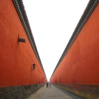 people walking between walls