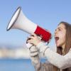 Woman yelling into a megaphone