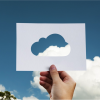 Person holding up a picture of a cloud