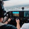 A cockpit's dashboards as a pilot flies a plane, photo by Kristopher Allison