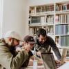 Three coworkers laughing in their office, photo by Priscilla Du Preez