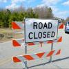 Roadblock sign reading "Road closed"