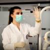 Doctor in a laboratory looking at a slide