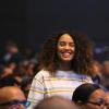 Smiling woman attending a software conference