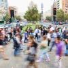 A crowd of people walking in the street