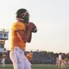 Quarterback about to throw a football